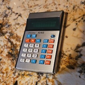 Unisonic 1040 Portable  Calculator - Silver with Blue & Red Keys